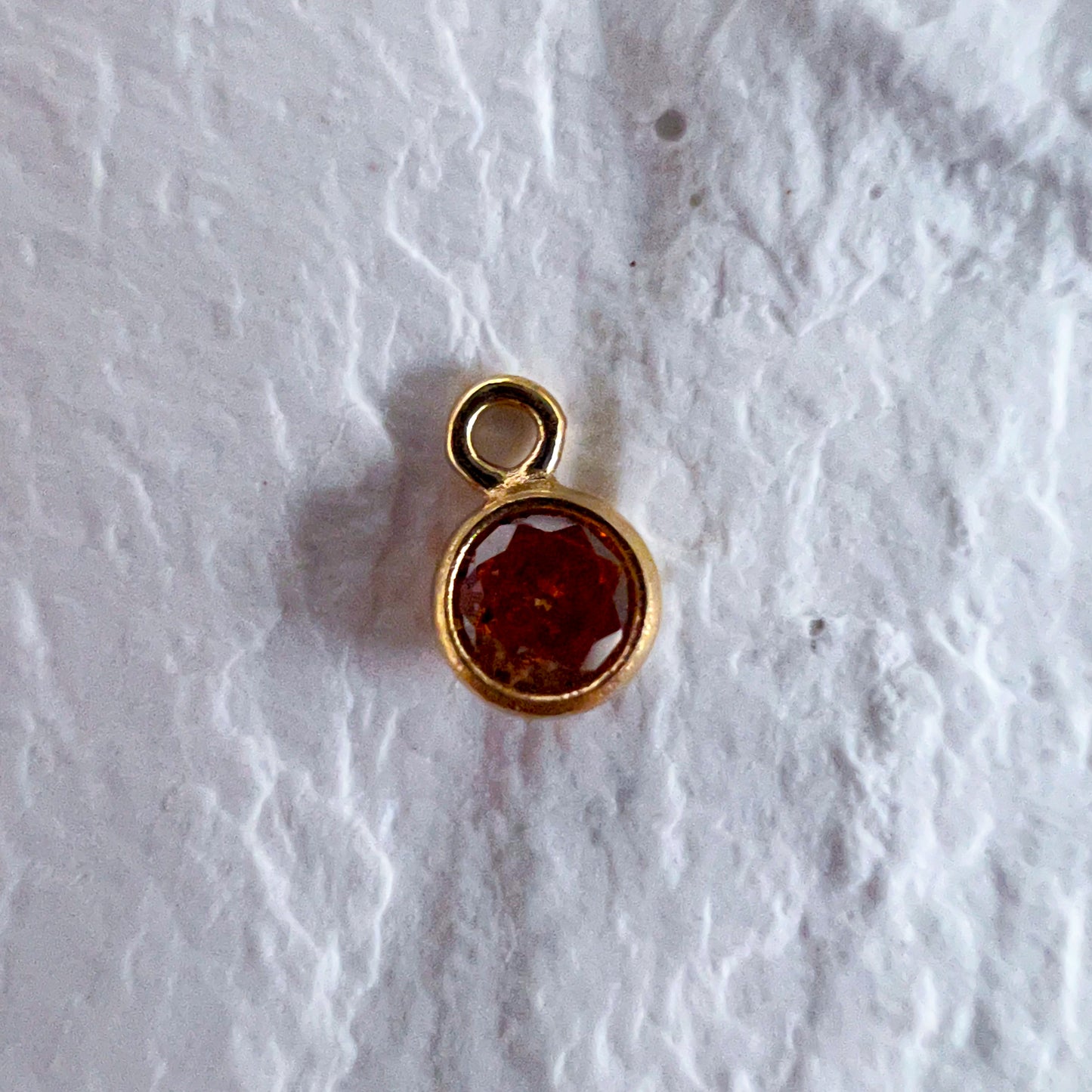Topaz Charm