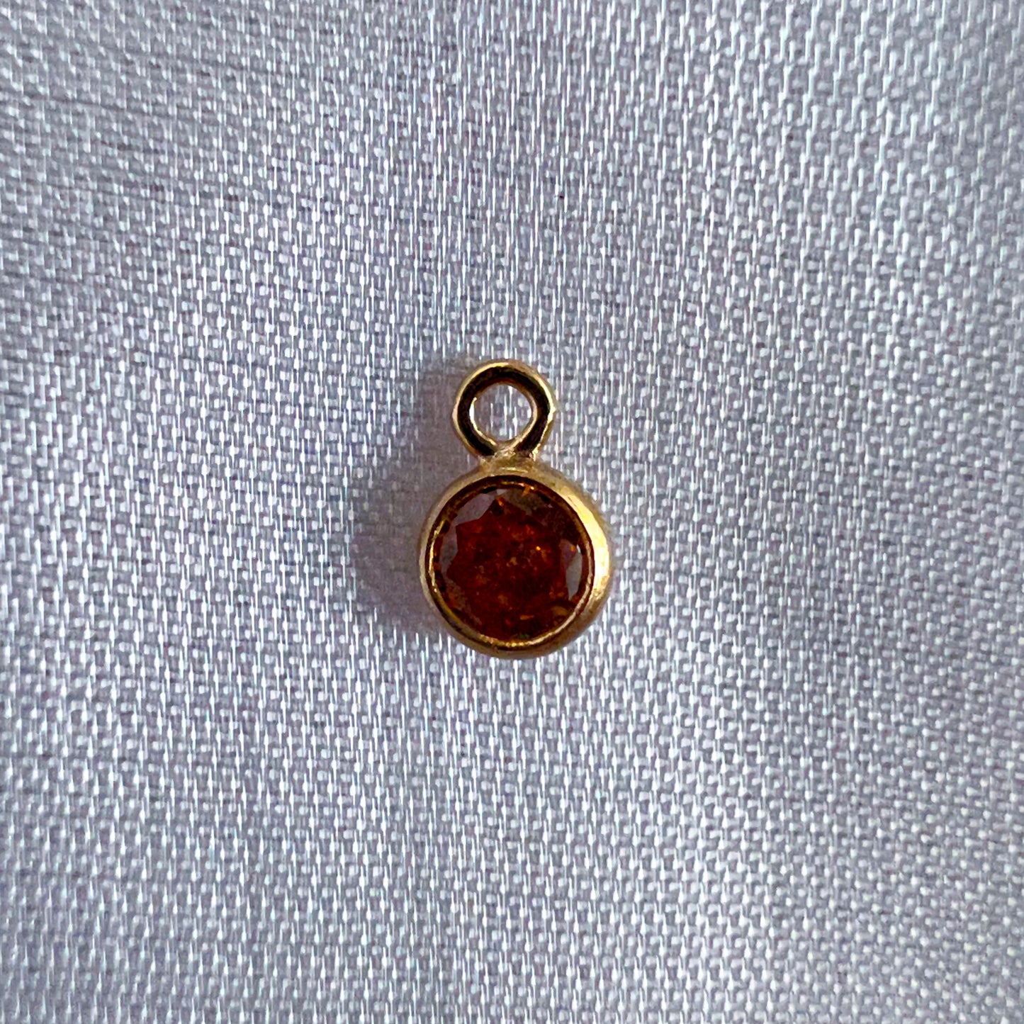 Topaz Charm